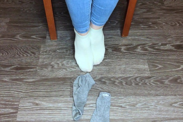 Girl showing her socks and feet