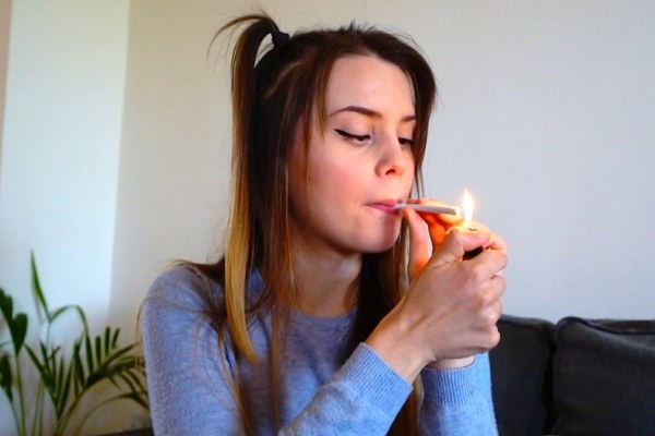 Homemade porn girl smokes a joint and really wants to fuck
